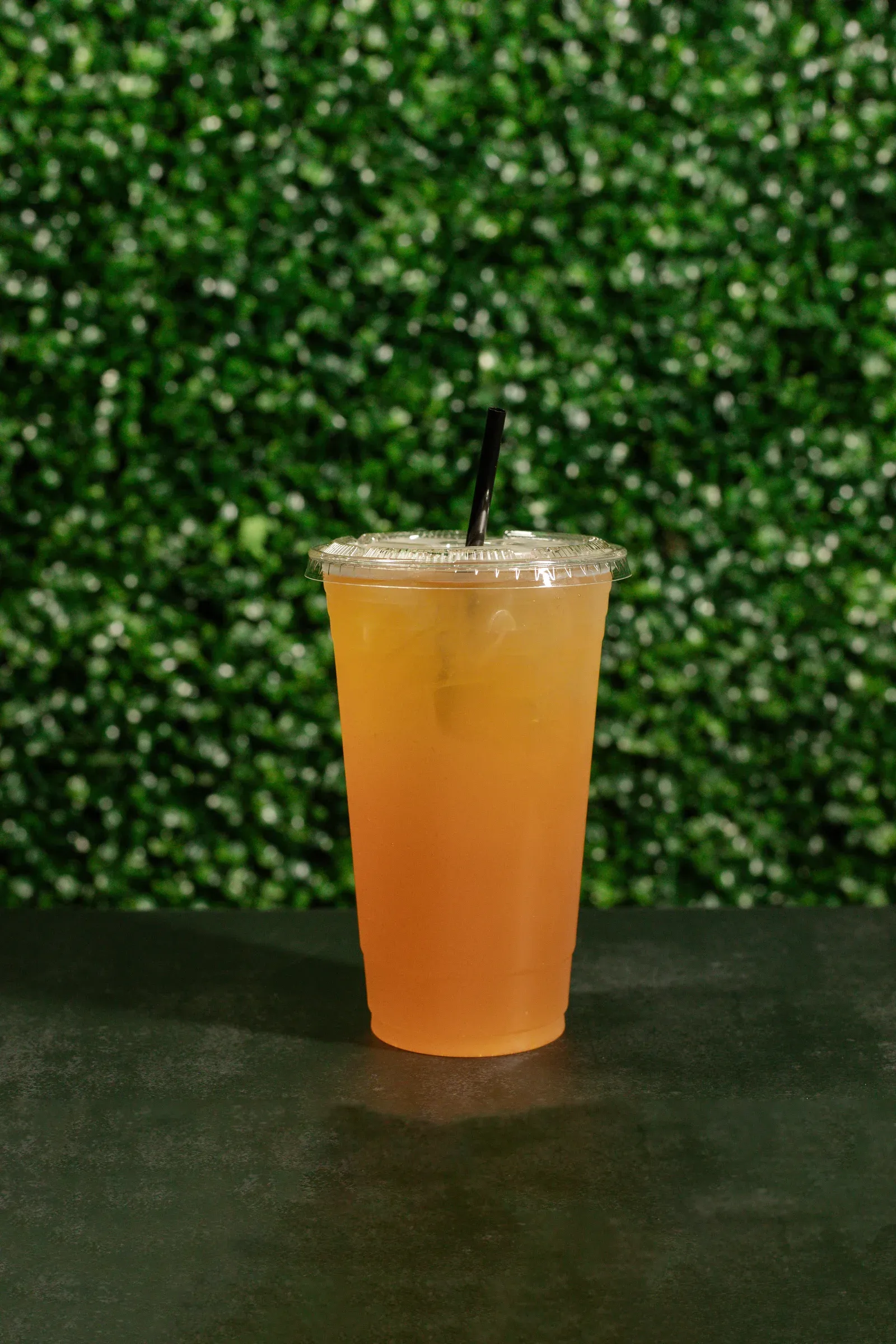 Orange Peach SpecialTea served over ice in a clear cup