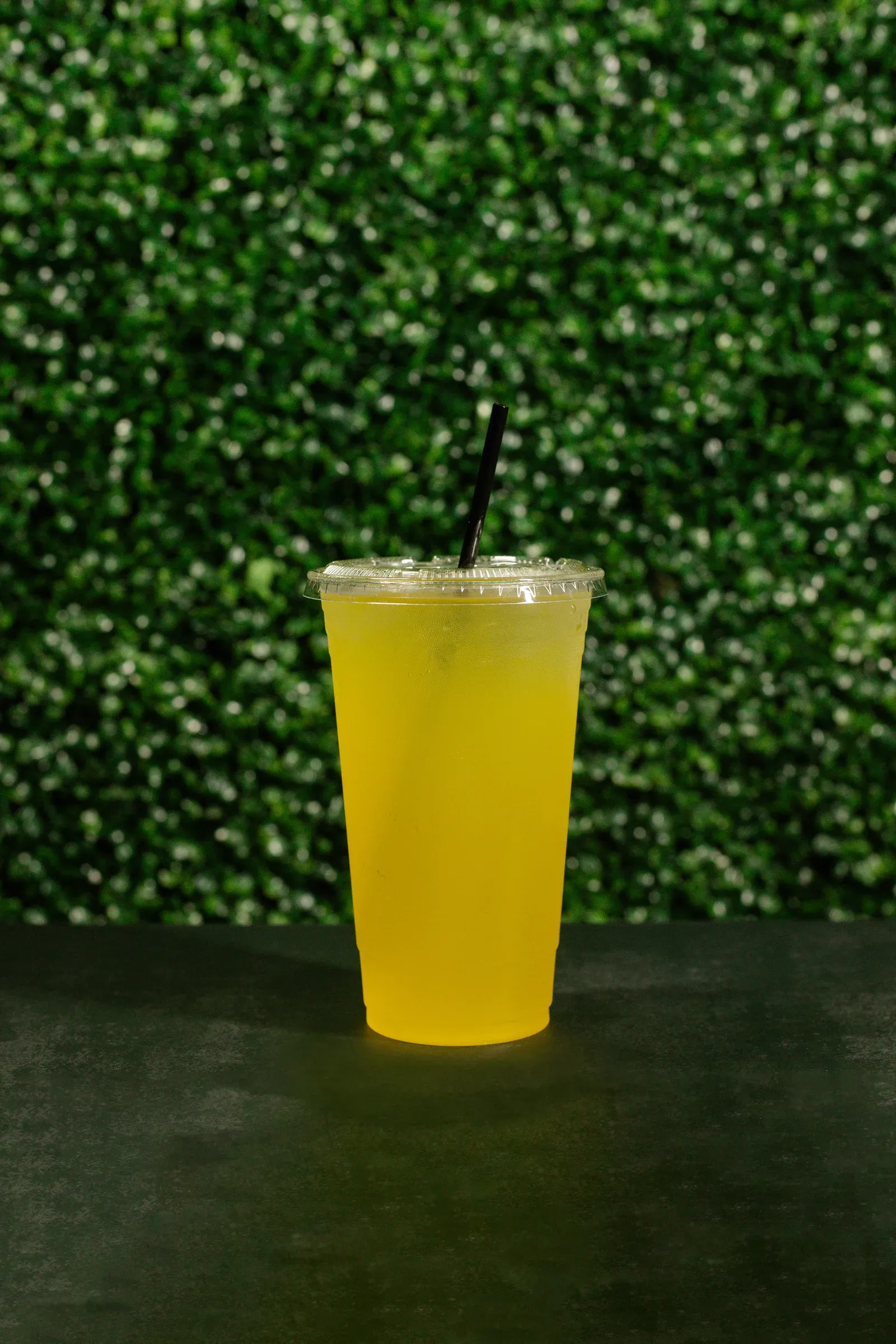 Yellow Piña Colada SpecialTea served over ice in a clear cup