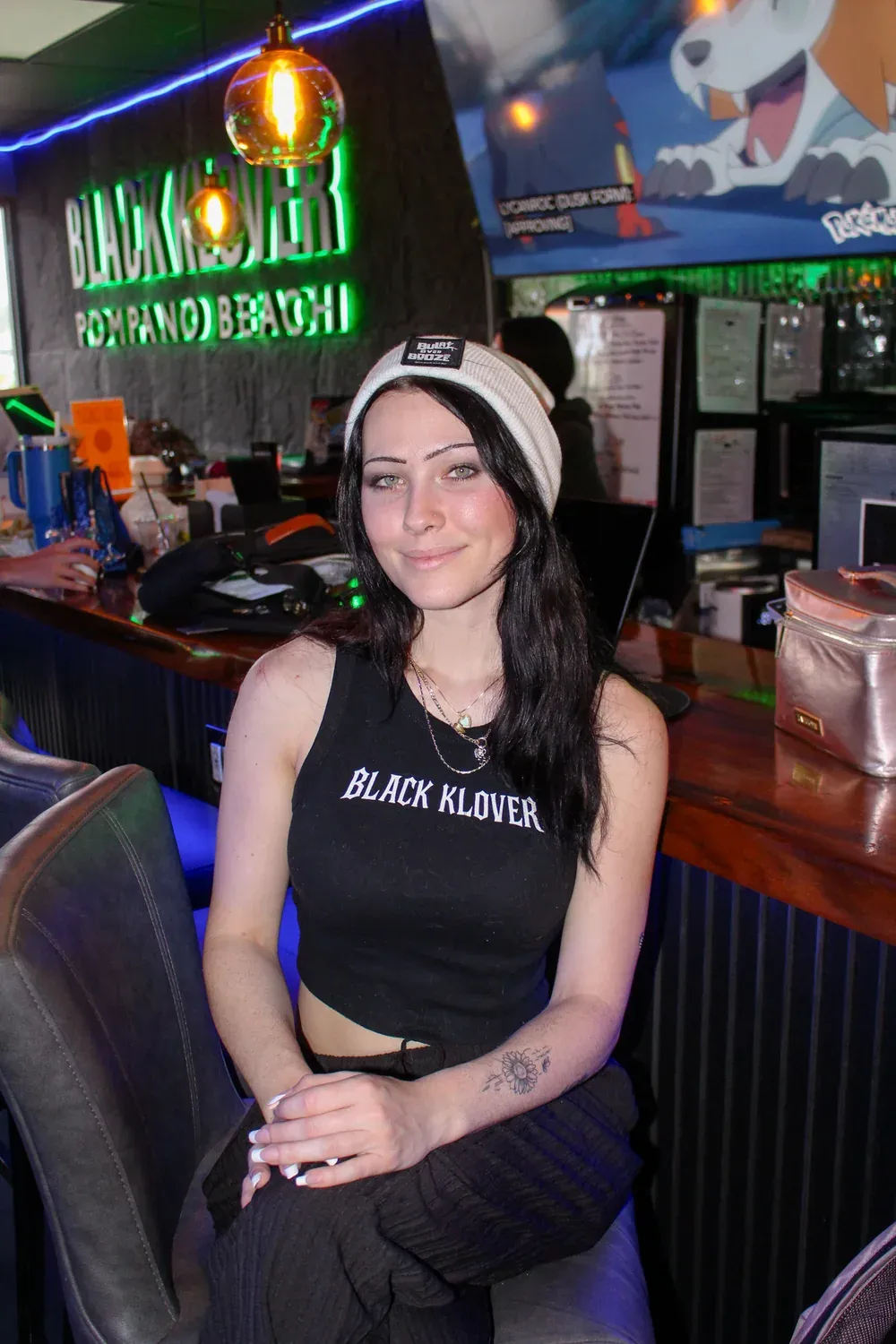 Rachel seated at the Black Klover bar