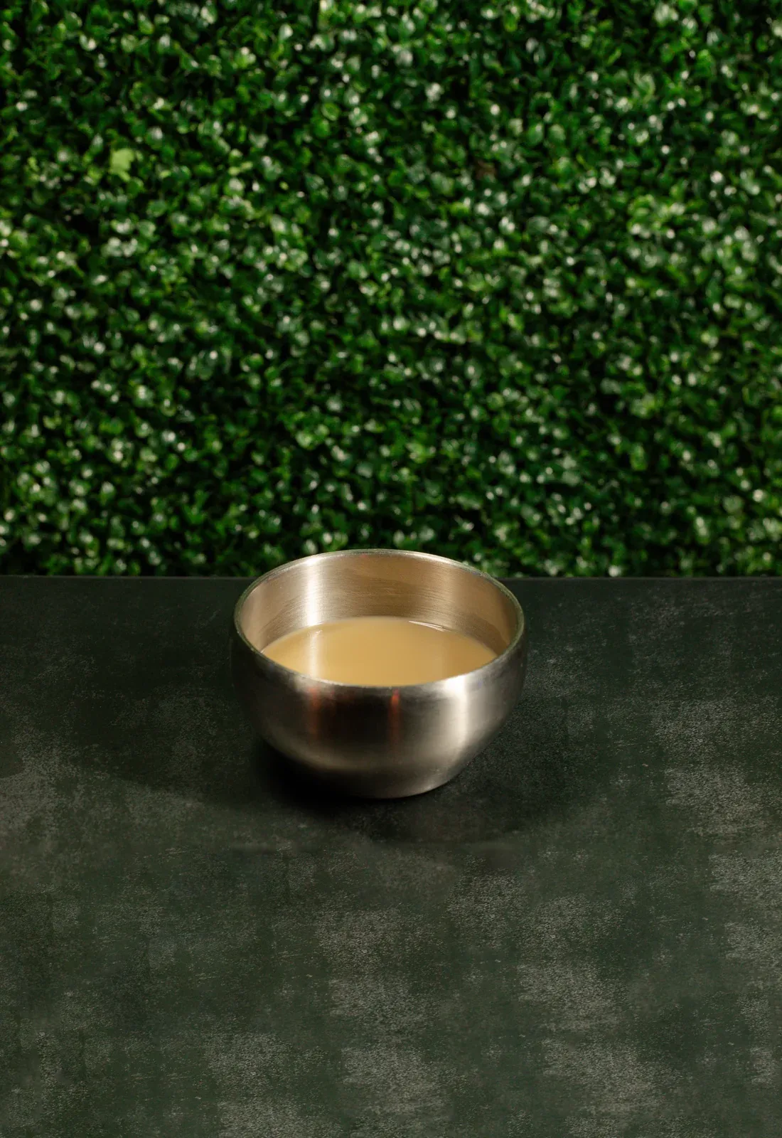 Traditional kava served in a metal shell